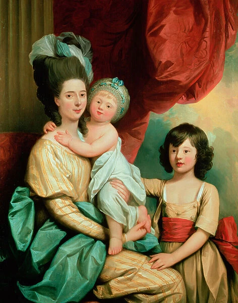 A group portrait of a lady and her two children