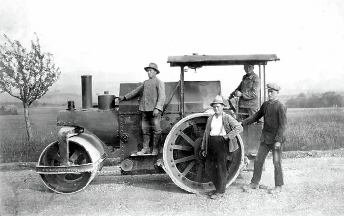 Framed Print : A group of road workers constructing a road, they use a roller vehicle. About 1920 Historic photograph, workmen, road construction, around 1920