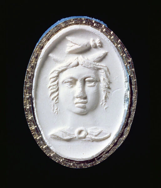 Impression of a gold ring with a facing head