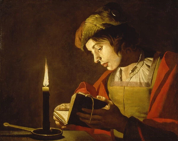 Un jeune homme lisant a la lumiere de la bougie - A Young Man Reading by Candlelight