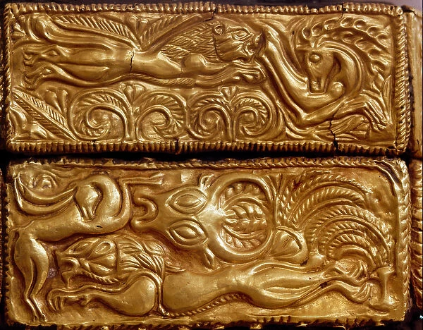 Lion hunting deer in a forest, detail of a wooden cassette covered with gold leaves