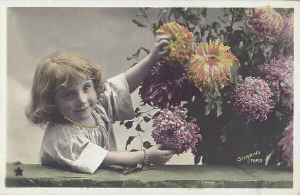 Little girl with flowers (colour photo)