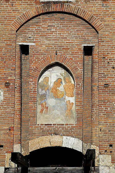 Main entrance of Castelvecchio in Verona depicting the virgin an