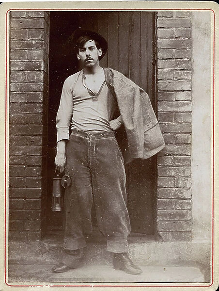 A miner poses in professional clothing, 1898