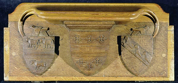 A misericord depicting three heraldic shields, New College Chapel, Oxford, late 14th century (wood)