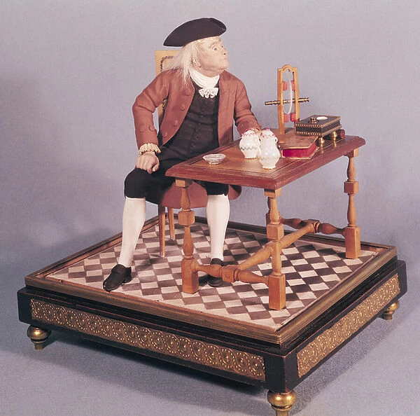 Model of Benjamin Franklin (1706-90) at his table, late 18th century