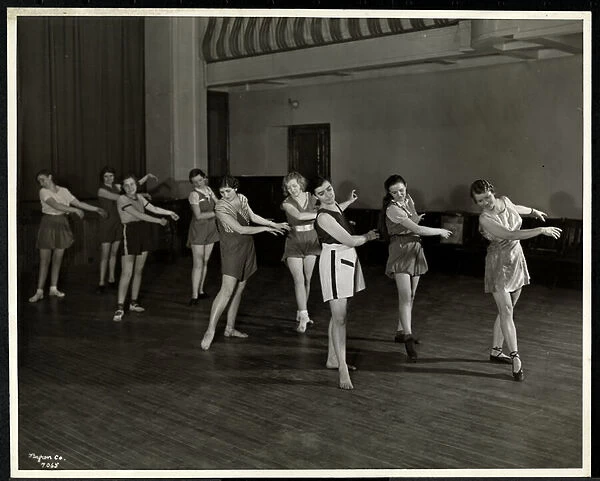 Mrs. Dean and eight dancing girls in the gymnasium of the New York Association for