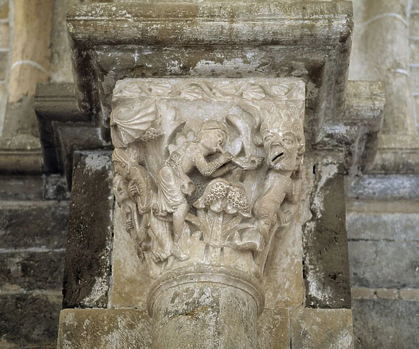 A musician and a demon symbolising lechery (carved capital)