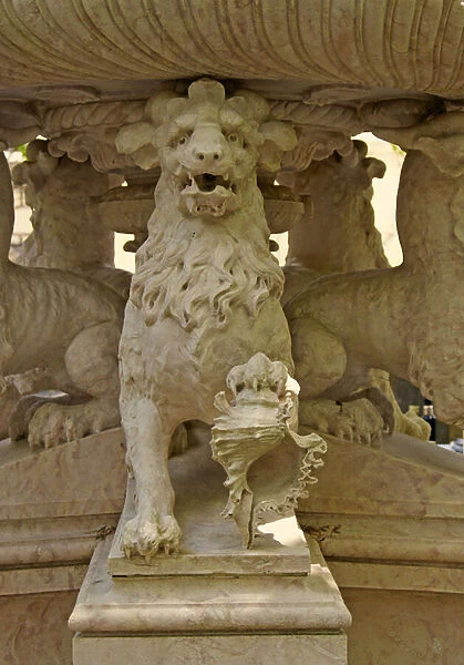 Mythical horned Lion Atlantes at the base of a fountain
