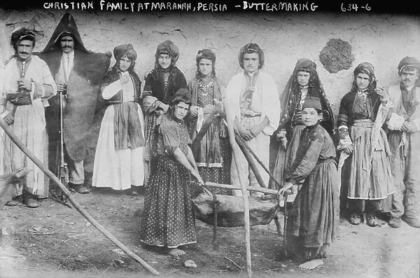 Nestorian (Assyrian) Christian family making butter (b  /  w photo)