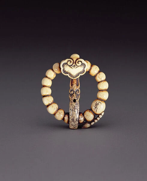 Netsuke in the form of a rosary with a stylised wishing wand, c. 1870 (stag-antler)