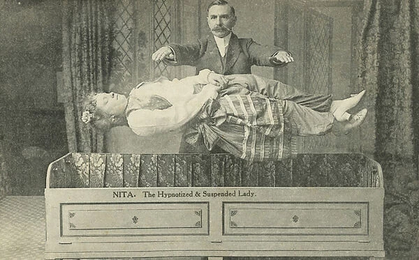 Nita, the hypnotized and suspended lady, magician performing a levitation trick (b  /  w photo)