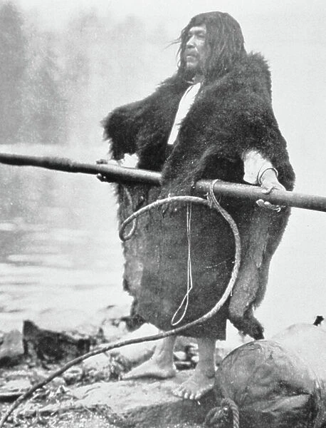 Nootka Indian with whaler harpoon, c. 1900 (b / w photo)