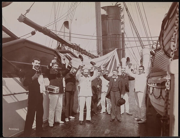Officers and crew toasting with champagne and cigars on the deck of the S. S