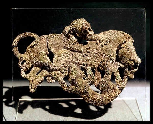 Ornamental plaque depicting a wild boar struggling with two tigers, from Tomb 3 at Shih-chai-shan