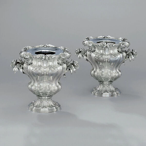 A pair of urn-shaped wine coolers with foliate scrolls and bullrush handles, c
