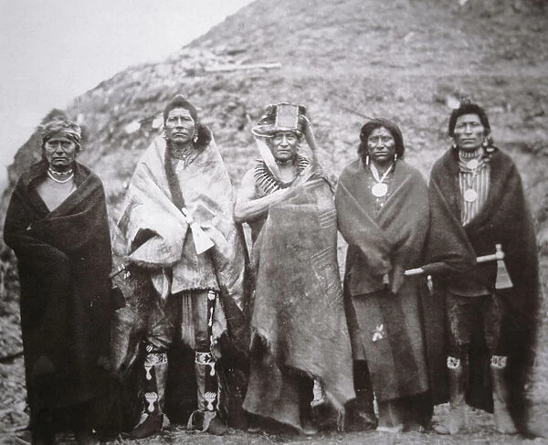 Pawnee people in front of a tribal earth lodge, c. 1869 (b  /  w photo)