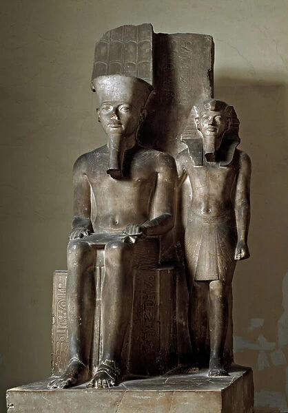 Pharaoh Tutankhamun standing near the divinite Amon-Ra on the throne