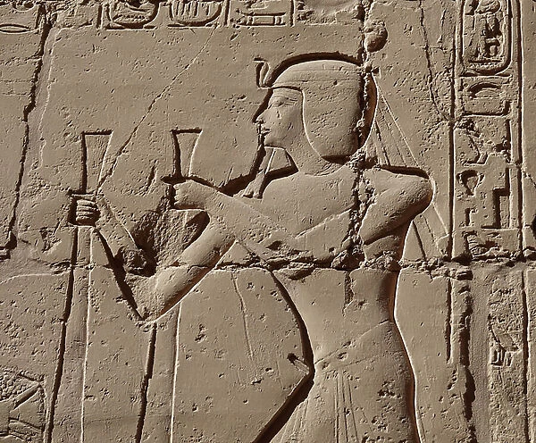 Pharaoh wearing a cobra, Luxor Temple (relief)