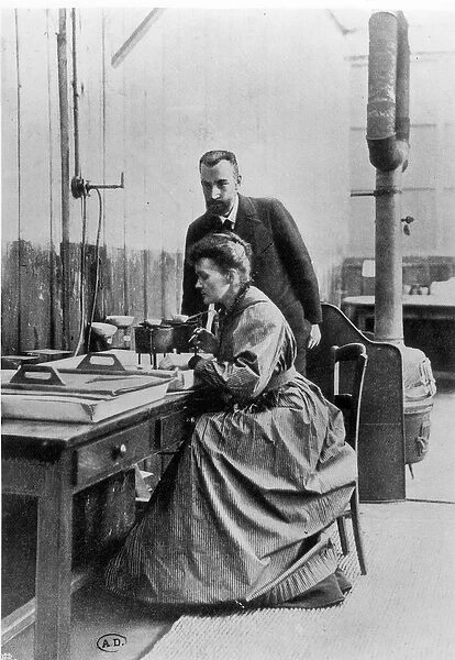 Pierre (1859-1906) and Marie Curie (1867-1934) in their laboratory, c. 1903 (b  /  w photo)