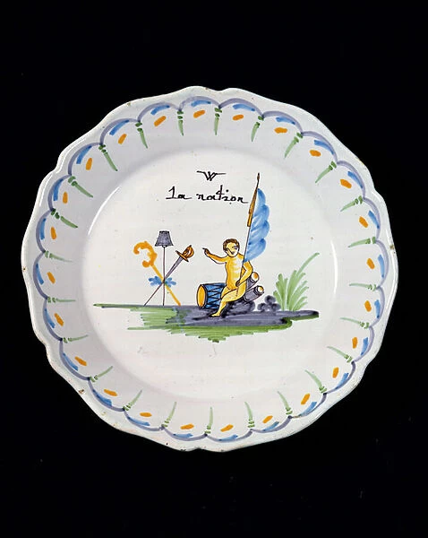 Plate decorated with a genie sitting on a drum, and the Three Orders of