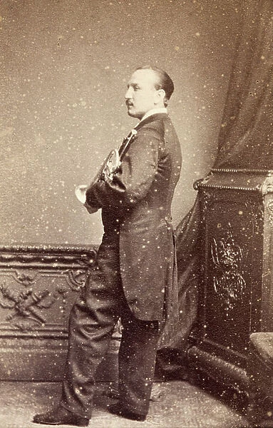 Portrait of Levey holding a trumpet, 1860s (b / w photo)