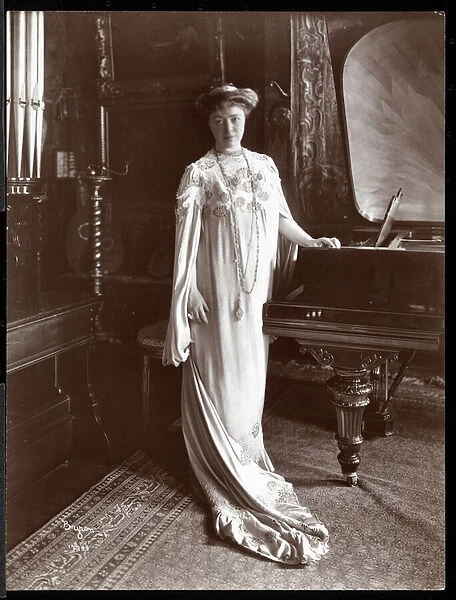 Portrait of Mrs. I. M. Clark standing by a piano, 1904 (silver gelatin print)