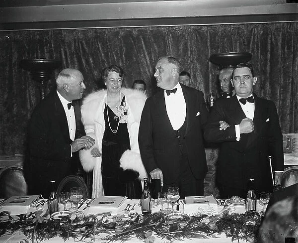 Postmaster General James A. Farley, First Lady Eleanor Roosevelt and U. S. President Franklin Roosevelt at Democratic Victory Dinner, Washington DC, 1937 (b / w photo)