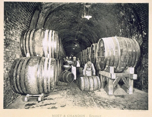 Pouring the wine into the barrels, from Le France Vinicole, pub. by Moet & Chandon, Epernay (photolitho)