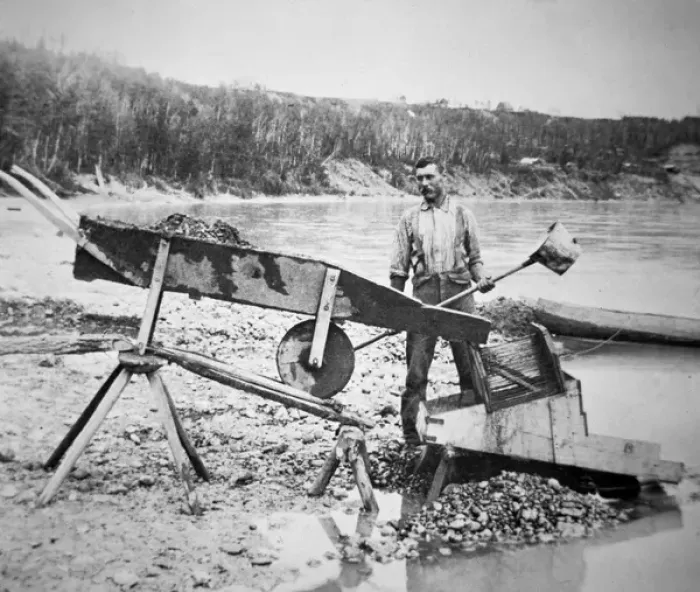 Framed Print : A prospector loading a rocker or cradle Framed Print : A prospector loading a rocker or cradle