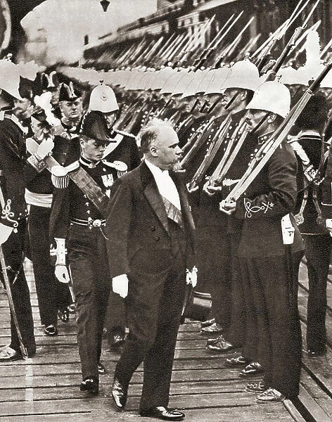 Raymond Poincare, 1860 - 1934. French statesman and five times Prime Minister of France, seen here reviewing a guard of honour on his arrival in England in 1913. From The Story of 25 Eventful Years in Pictures published 1935