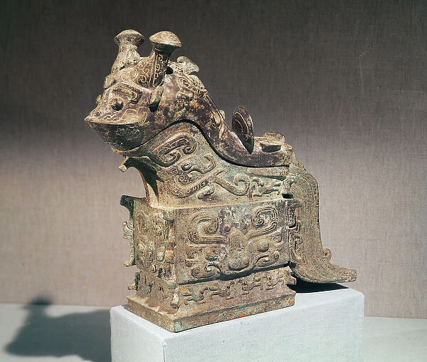Ritual kuang wine mixer in the shape of a monster inscribed with jih chi