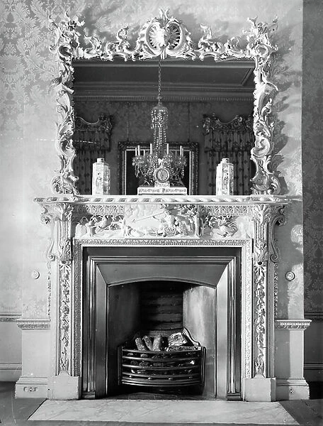 The Rococo boudoir chimneypiece at Castle Hill, Devon, from England's Lost Houses by Giles Worsley (1961-2006) published 2002 (b / w photo)