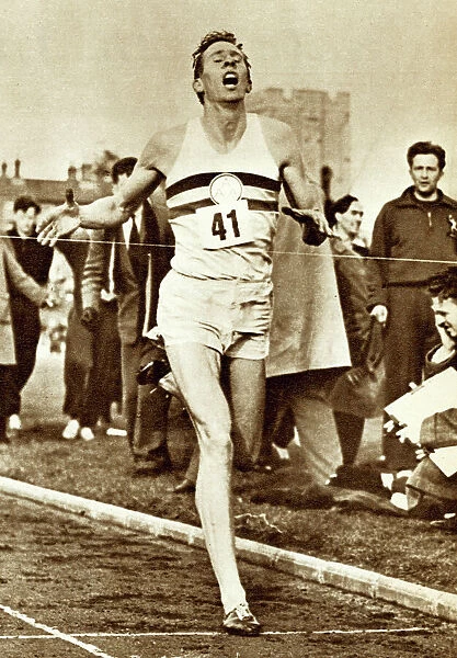 Roger Bannister breaking the tape to become the first man to run a mile in four minutes (b  /  w photo)