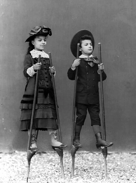 Romualdo Alinaris children, Adele and Arturo, on stilts, Florence, c. 1875 (glass plate)