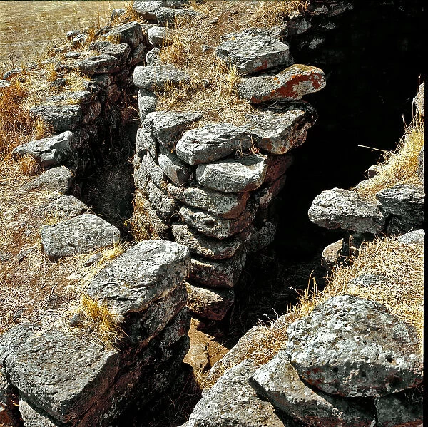 Ruins of one of the defensive towers. 15th century BC (photography)