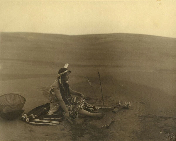 A seated Native American woman (b  /  w photo)