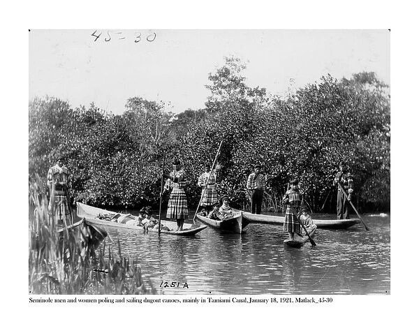 Seminole men and women poling and sailing dugout canoes on Tamiami Canal, 18 January