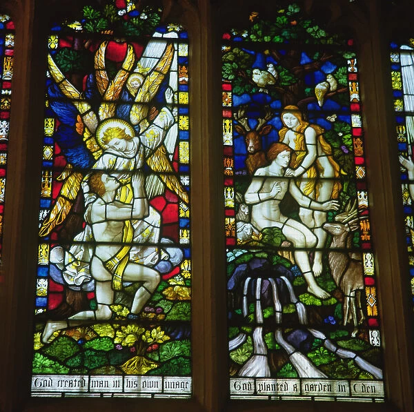 Stained glass windows depicting (LtoR) The Annunciation and Adam