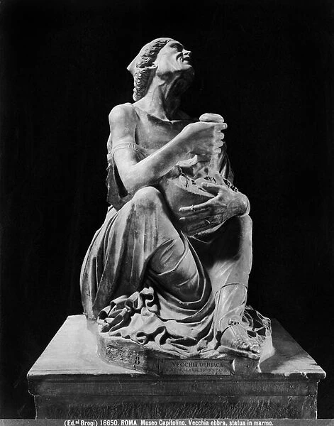 Statue of an old drunken woman holding a wineskin (marble)
