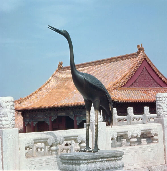 Statue of a stork with a side pavilion of the Hall of Supreme Harmony in the background