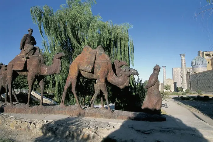 Framed Print : Statues in front of a tree, Statue Of A Caravan Train, Samarkand, Uzbekistan (photo)