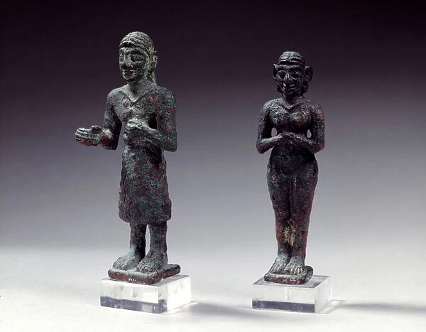 Statuettes of worshipers and goddess in bronze, from Syria 2300-2000 BC