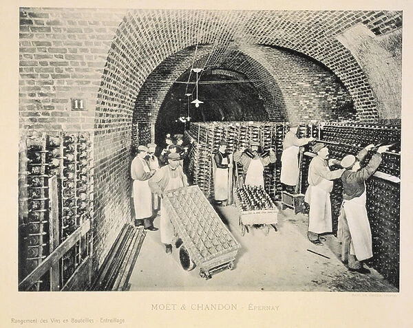 Storing the wines in bottles in a rack, from La France Vinicole, published by Moet & Chandon, Epernay (photolitho)