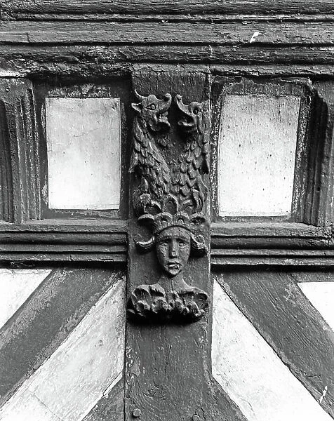 Detail of a supporting bracket on the gatehouse range, Little Moreton Hall, Cheshire, from The English Country House (b / w photo)