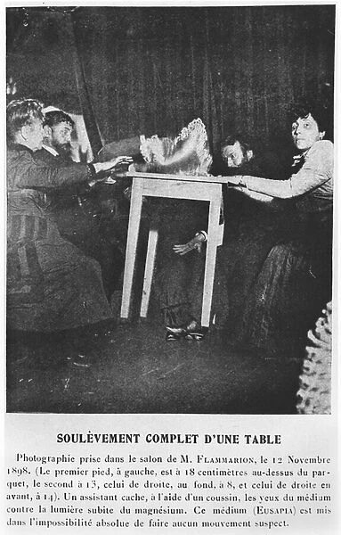 A table levitating during a seance with Eusapia Palladino (1854-1918