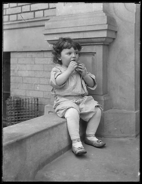 Toddler Duffy, on front stoop of Vermilyea Avenue apartment building, New York