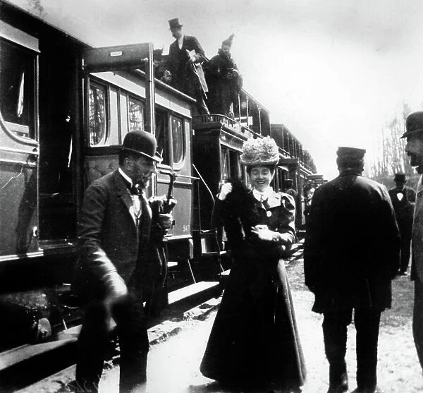 Travels by railway in France late 19th century : here arrival of travellers probably at the sea