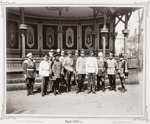 Tsar Nicholas II (1868-1918) standing in the garden pavilion of the Palace with a group
