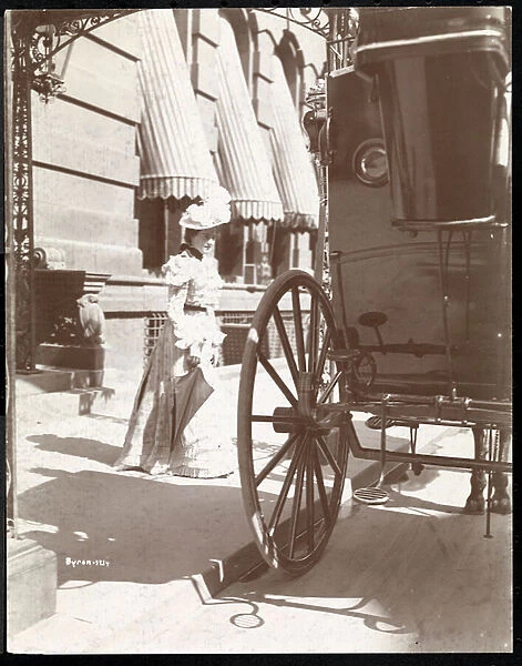 Woman approaching a carriage at the Waldorf Astoria Hotel, 34th Street and 5th Avenue